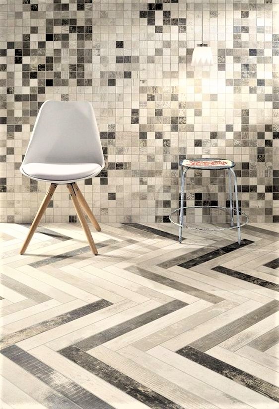 pavimento e rivestimento in gres colorato in grigio e bianco con sedia 